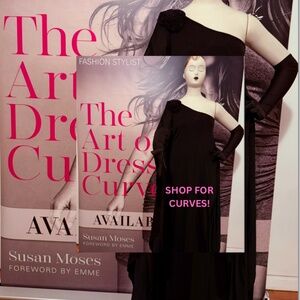 Black one shouldered gown with black rose embellishment  on shoulder.